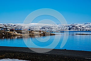 Fishing village in Icelandic fjord in winter