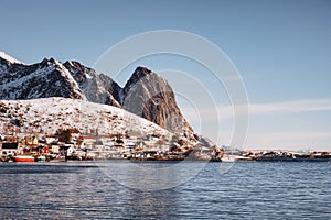 Fishing village with mountain on coastline in winter at Lofoten Islands