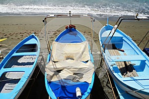 Fishing wooden boat moored on the beach