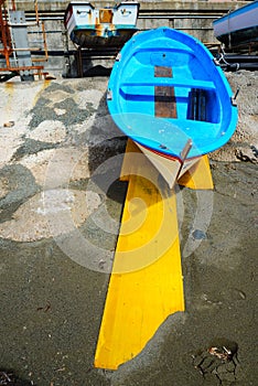 Fishing wooden boat moored on the beach