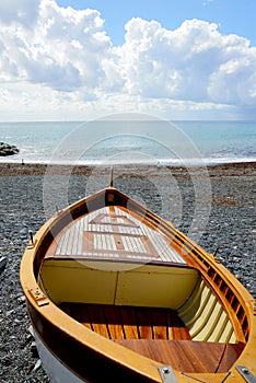 Fishing wooden boat moored on the beach