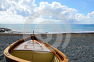 Fishing wooden boat moored on the beach