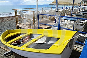 Fishing wooden boat moored on the beach