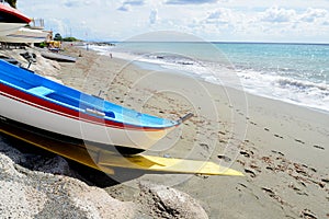 Fishing wooden boat moored on the beach