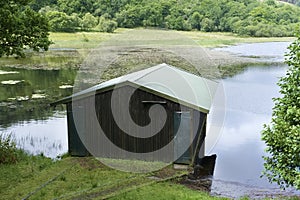 Fishing wooden shelter hut and log store on Rothesay Scotland for fisherman and anglers