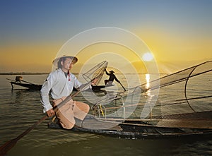 Fishman and net in Canoe sunrise