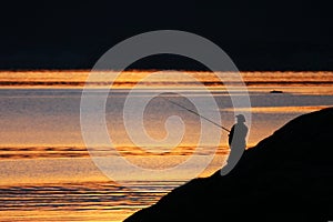 Fishman and sunset photo
