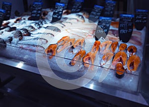 Fishmarket ice-shelf with the salmon steaks on foreground photo