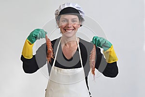 Fishmonger showing two a prawns on white