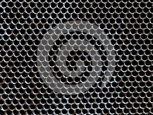 Fishscales of a metal fence. photo