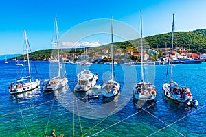 Fiskardo, Kefalonia, Greece: Panoramic view of the Fiskardo bay over the village and the boats ancored in the bay photo