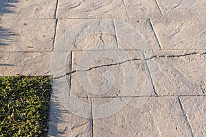 Fissured stamped concrete pavement outdoor, appearance colors and textures of paving slate stone tile on cement