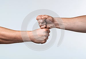 Fist bump. Clash of two fists, vs. Gesture of giving respect or approval. Friends greeting. Teamwork and friendship