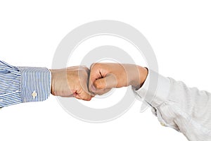 Fist bump on formal wear, gesturing an agreement and cooperation