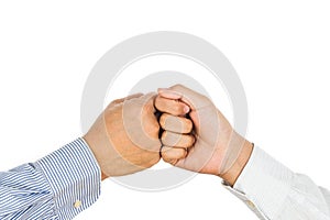 Fist bump on formal wear, gesturing an agreement and cooperation