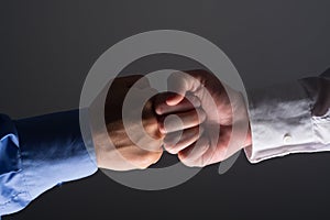 Fist bump handshake between businessmen