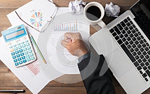 Fist business man hand on office desk