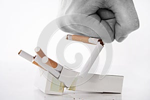 Fist crushing cigarettes