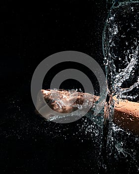 Fist Hand gesture in the form of a fist in the water