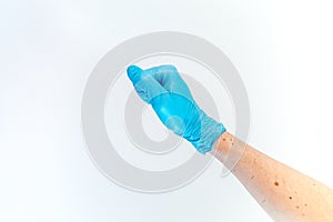 Fist hand in medical glove on white background