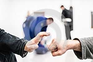 Fist hands bump at the brazilian Jiu Jitsu training