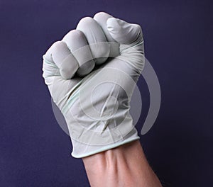 Fist in medical glove