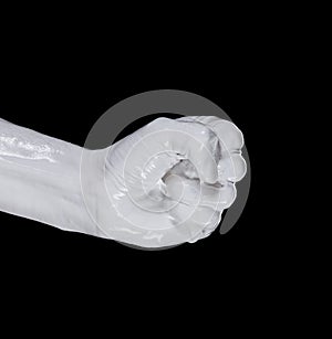 Fist painted with white paint, hand isolated symbol, arm