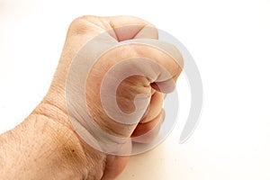 Fist of a person banging on a table