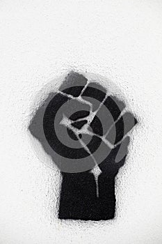 Fist symbol icon on a wall