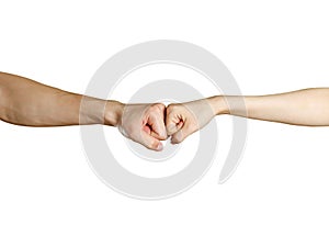 Fist to fist. Male vs female hand. Isolated on a white background