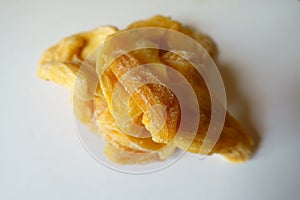 Fistful of yellow dried jack fruit chips