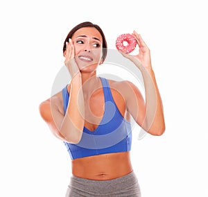 Fit adult woman choosing sugary food