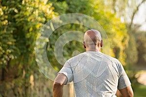 Fit African American man running.