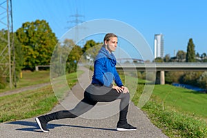 Fit athletic woman limbering up