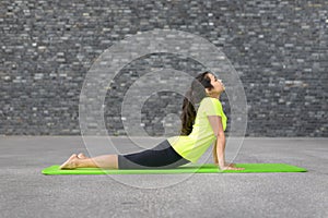 Fit athletic young woman doing yoga exercises