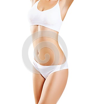 Fit and sporty girl in white underwear. Beautiful and healthy woman posing over white background. Sport photo
