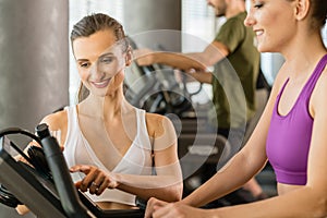 fit and beautiful young women the gym on treadmill