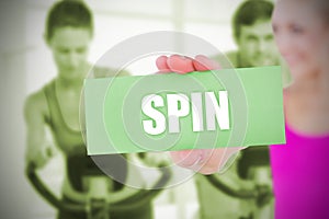 Fit blonde holding card saying spin