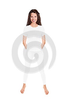 Fit brunette woman wearing white leggings and a shirt