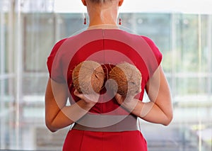 Fit business woman with two coconuts