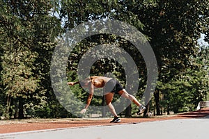 Fit Caucasian Man Exercising Muscles and Doing Cartwheels in Natural Environment Park