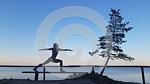 Fit caucasian woman practicing yoga outside