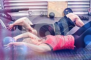 Fit couple doing abdominal ball exercise