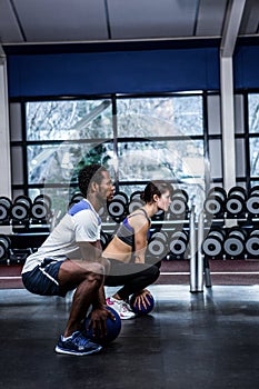Fit couple exercising with medicine ball