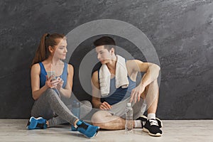 Fit couple with smartphone listening to music