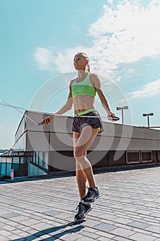 Fit fitness woman doing fitness exercises outdoors