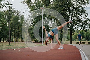 Fit girl in a green park perform impressive 360-degree cartwheels and flips, showcasing their athleticism, flexibility