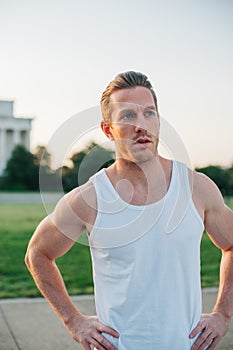 Fit and handsome caucasian man hands on hips portrait on the National Mall