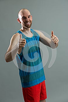 Fit handsome man giving thumbs up
