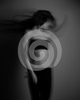 Fit healthy body woman dancing in black clothing. Fitness dance class. Lady performing movements on studio background with windy